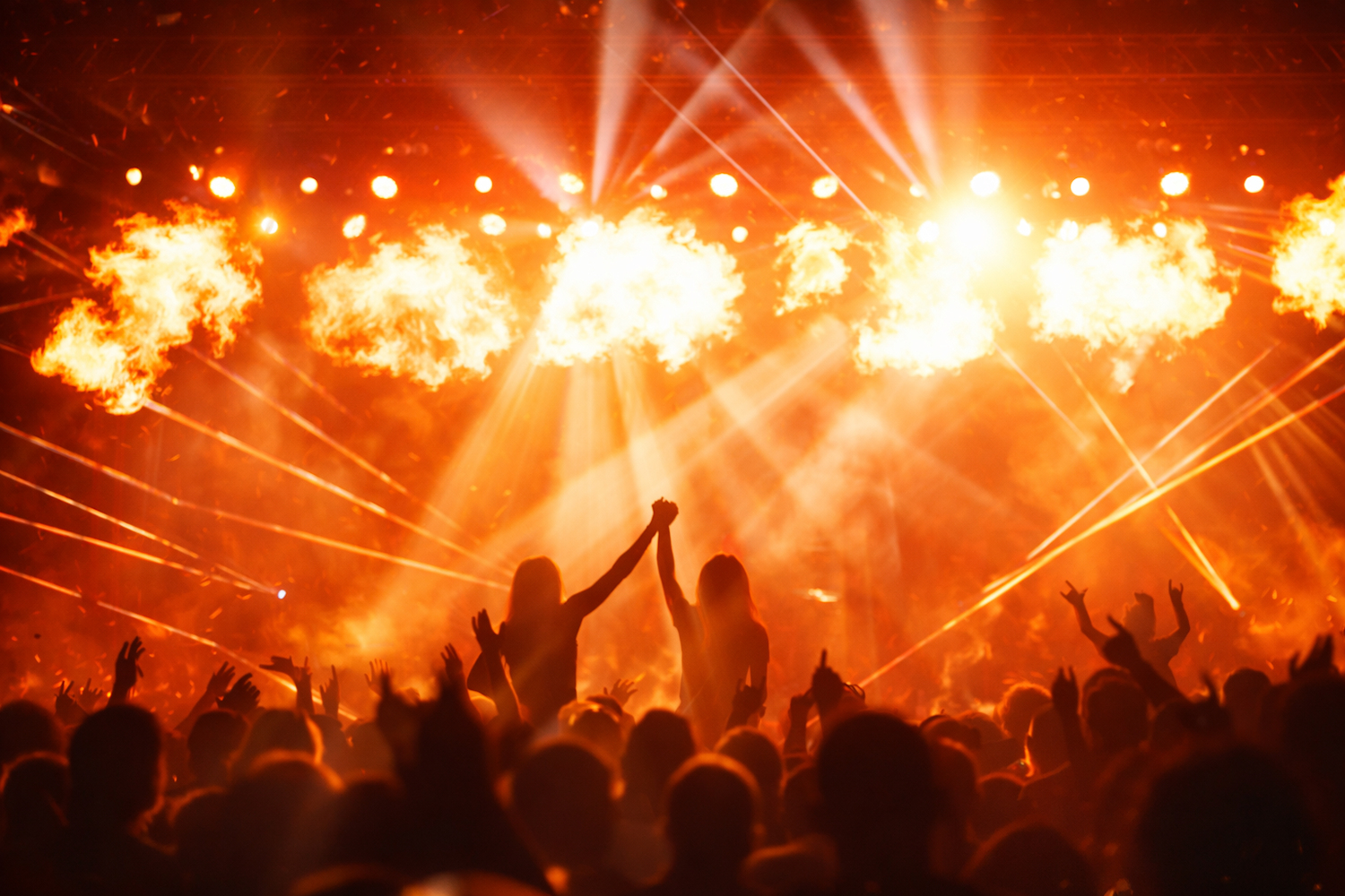 Crowd with lights and flames at a live show